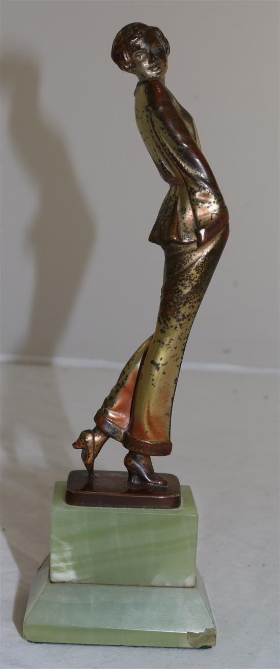 A Lorenzl patinated bronze figure of a young lady wearing a pyjama suit, 9in.